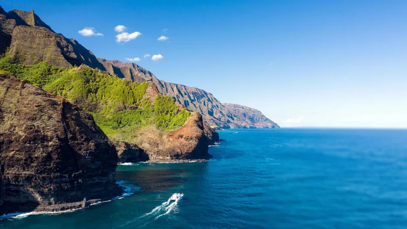 Catamaran off the island of Niihau on a Napali Coast boat tour full day from Port Allen, Kauai