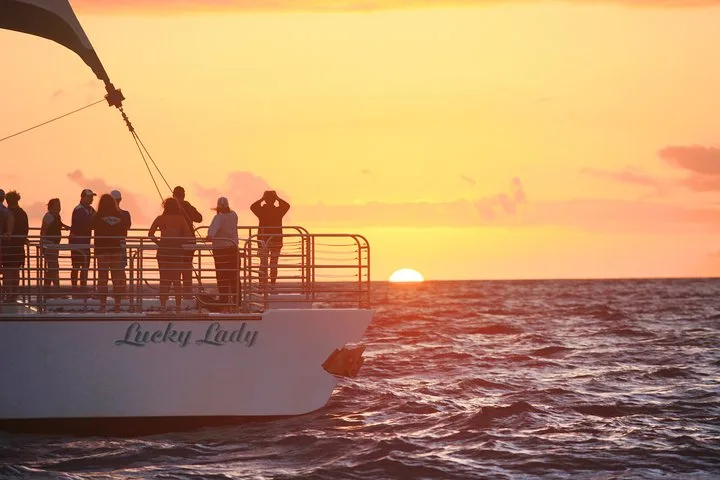 Luxury catamaran in the evening light on a Na Pali Coast boat tour sunset cruise from Port Allen, Kauai