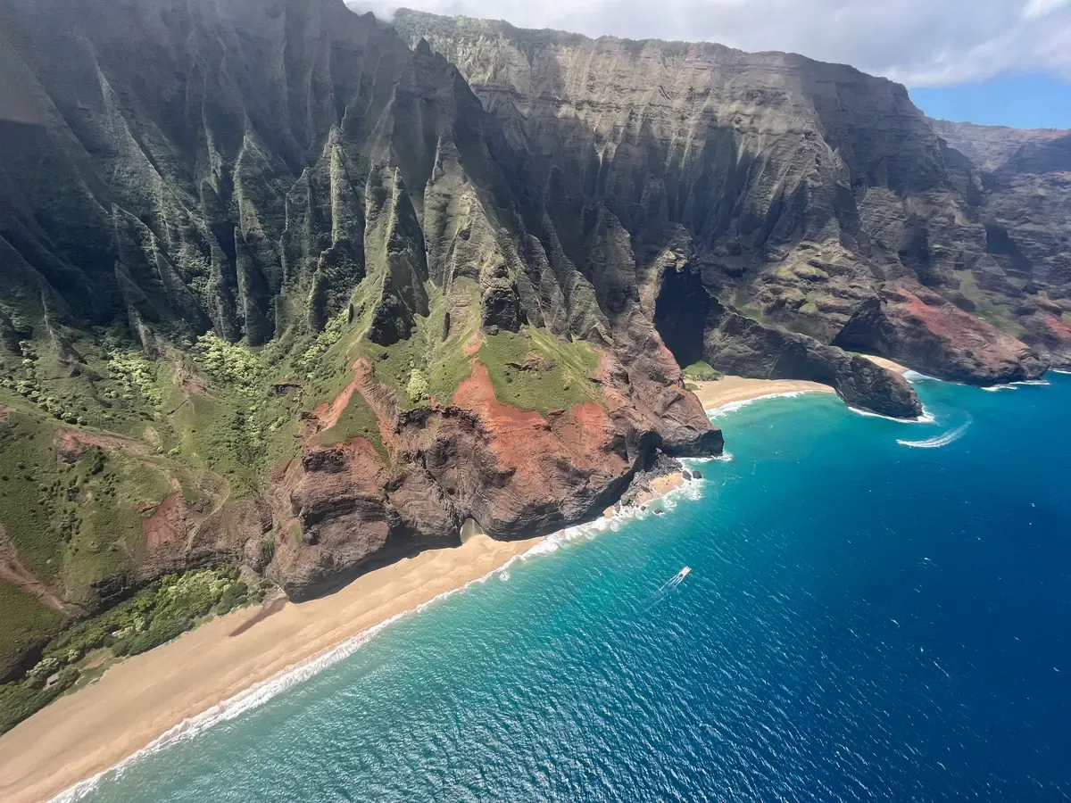 Kalalau Beach and turquoise water below the cliffs, the north end that summer Napali Coast boat tours reach