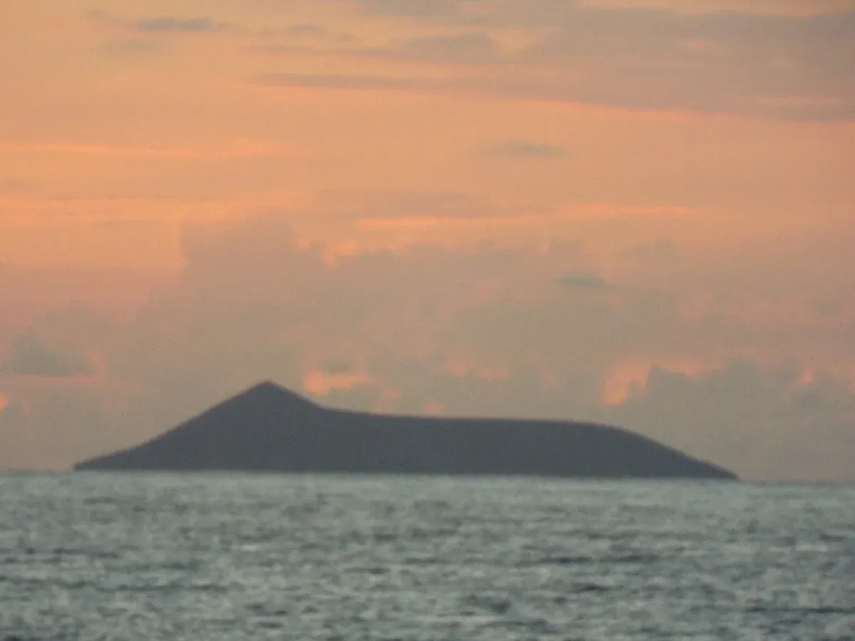 Lehua island off Niihau at sunset, seen from a boat on the full-day Napali Coast boat tours